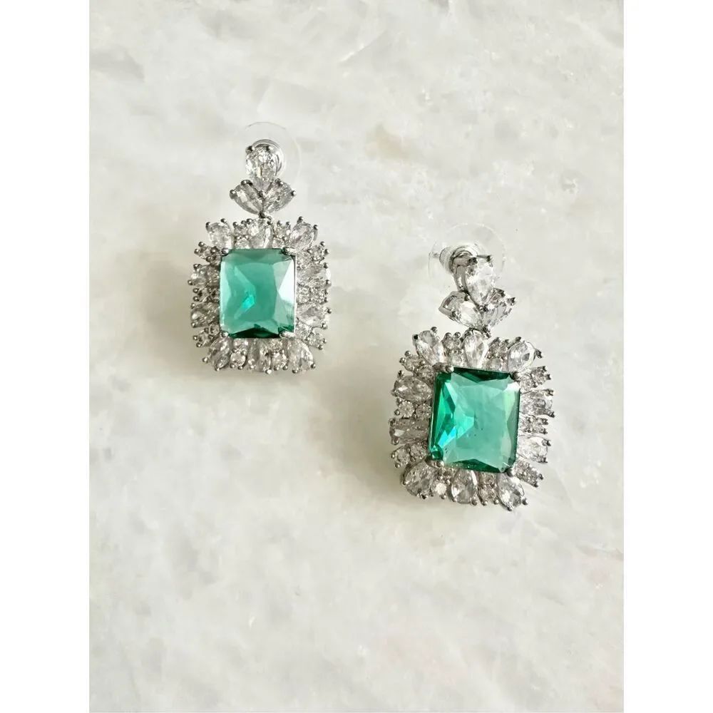 Cubic zirconia and aqua blue cushion cut dangle earrings